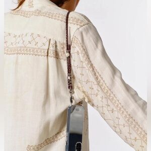 Ossa New York leather bolo and pearl shoulder length strap